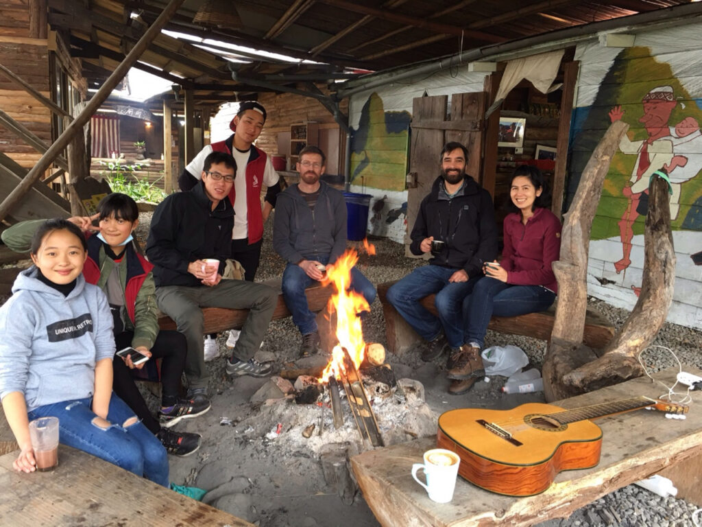 Enjoying hot drinks around a fire in the Tayal Indigenous community of Smangus village in Hsin-Chu County.